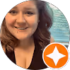 Smiling woman with brown hair against a turquoise water background and an orange star badge on the bottom right.