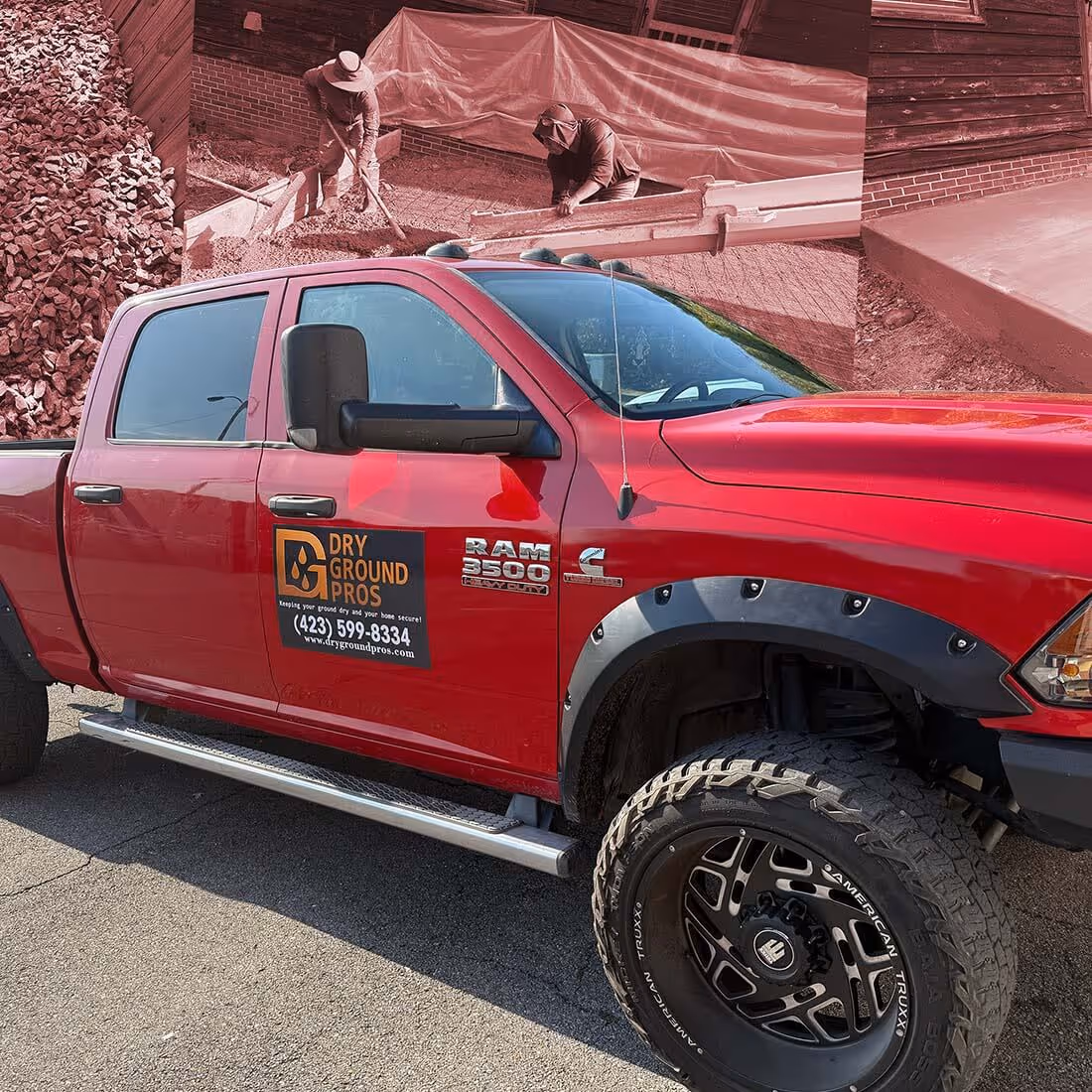 Red RAM 3500 pickup truck with Dry Ground Pros logo and contact information on the door, parked on pavement.